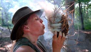 Blowing a tinder bundle into fire